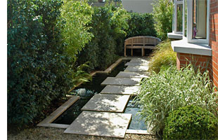 Regular maintenance highlights the strong impact of this courtyard garden.